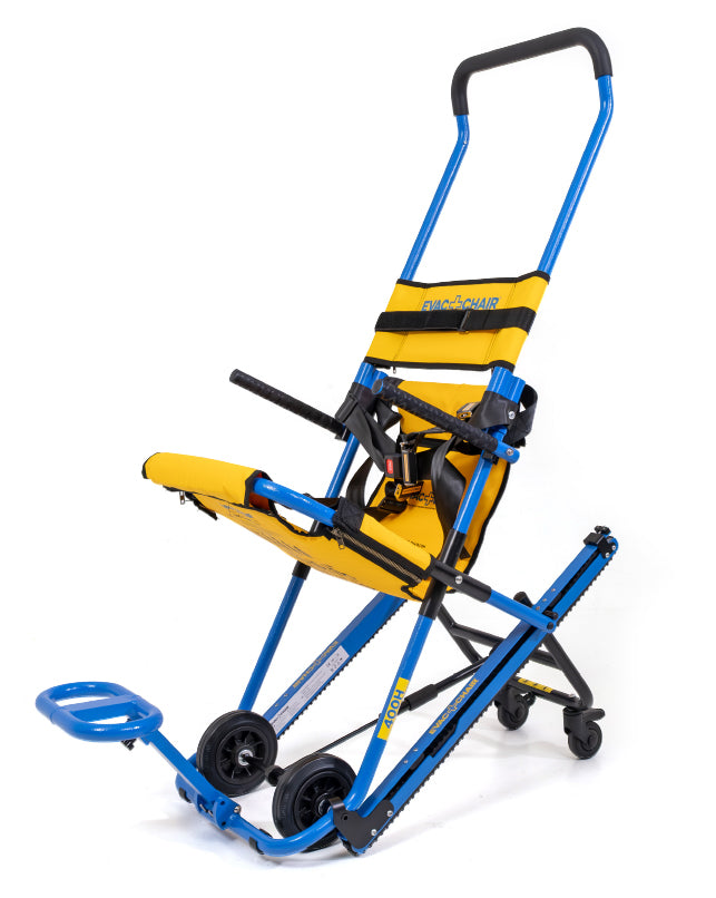 Silla de evacuación Evac+Chair 400H desplegada, vista frontal: estructura azul, asiento amarillo con arnés, apoyabrazos, apoyapiés y orugas para escaleras.